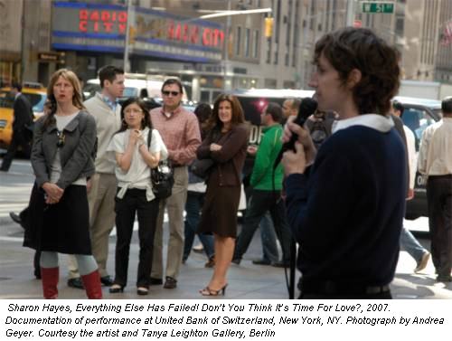 Sharon Hayes, Everything Else Has Failed! Don�t You Think It�s Time For Love?, 2007. Documentation of performance at United Bank of Switzerland, New York, NY. Photograph by Andrea Geyer. Courtesy the artist and Tanya Leighton Gallery, Berlin